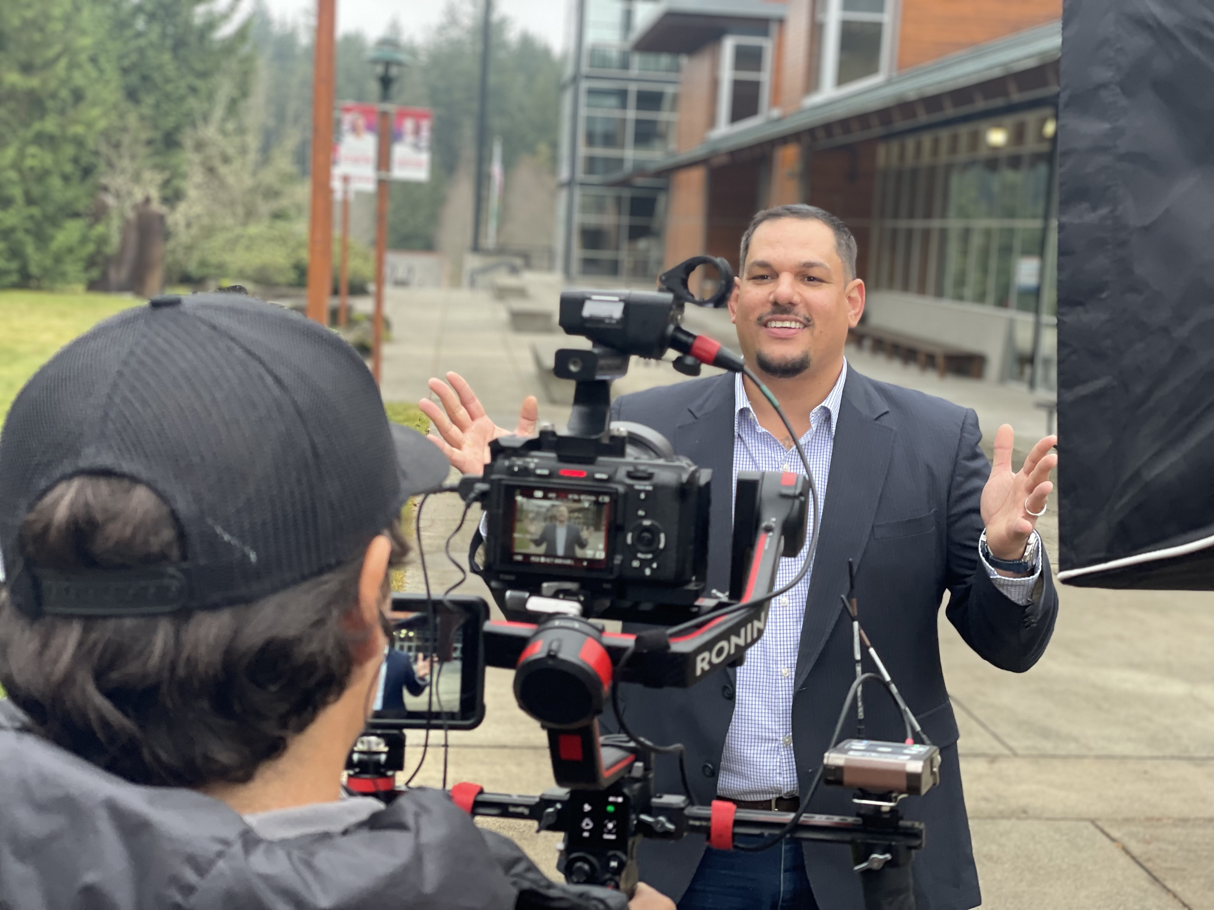 Student outdoors at Poulsbo Campus and posing for camera